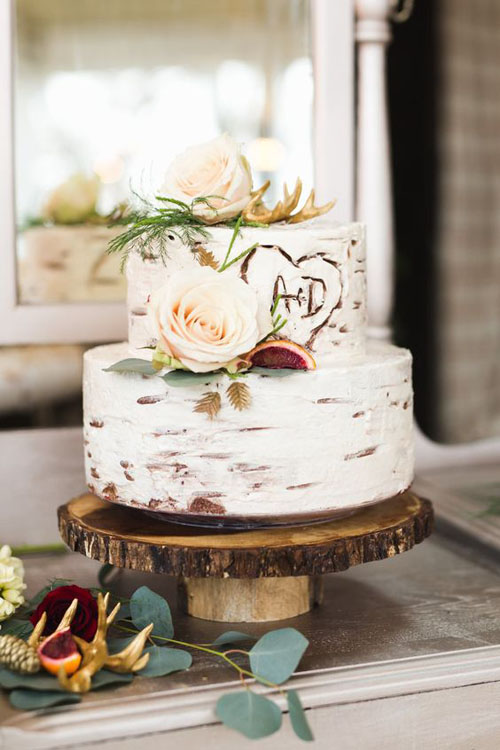 rustic wedding cake with wood accents