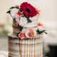 rustic wedding cake with naked frosting and flowers