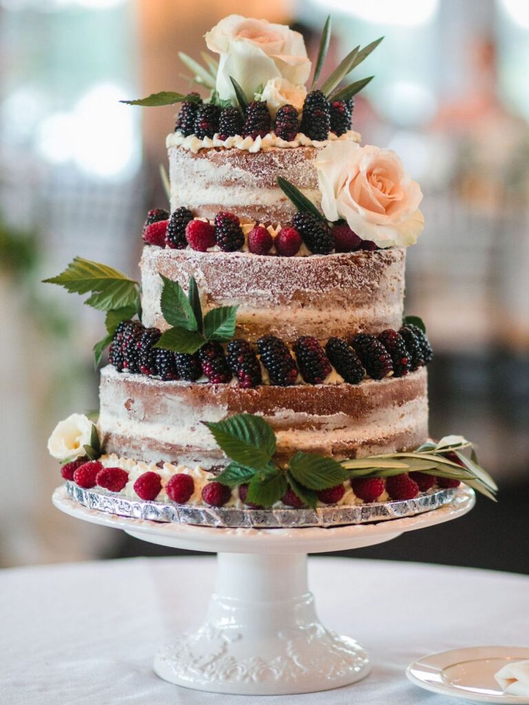 rustic wedding cake topped with fruit