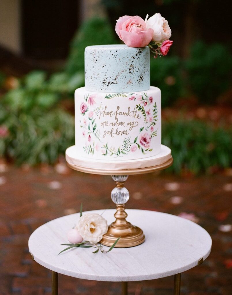 two color tiered wedding cake with calligraphy