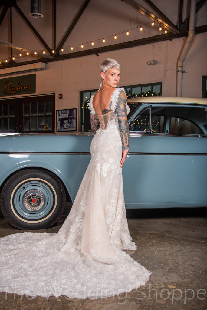 lace wedding gown on tattooed bride