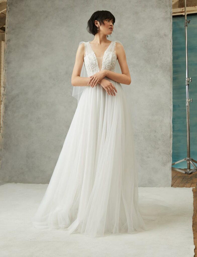 woman in plunged neckline couture wedding gown