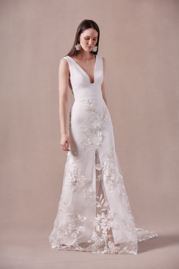 woman in white plunge designer wedding gown