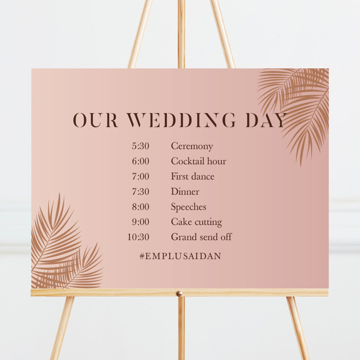 A wedding sign displaying the times for events