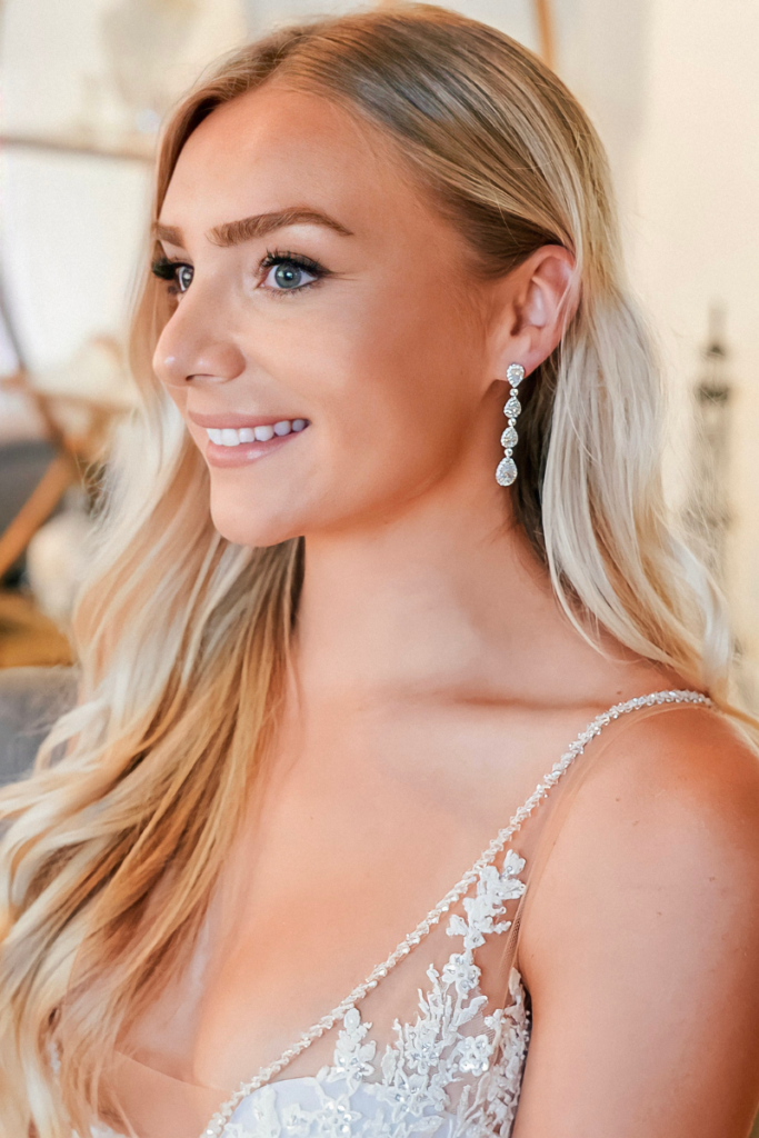 woman wearing multi-diamond earrings