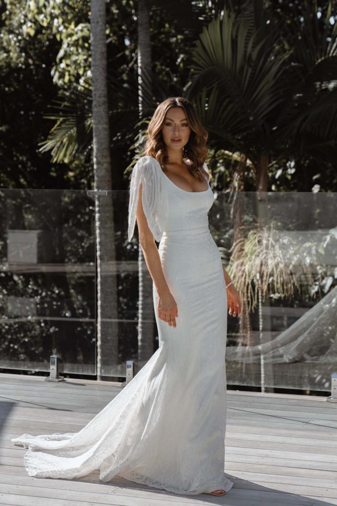 woman in white bridal gown with petal sleeves from Finley