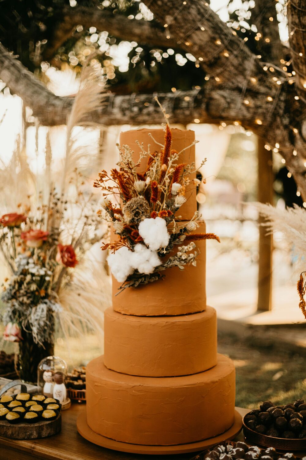 A fall wedding cake romantic vignette at a boho wedding.
