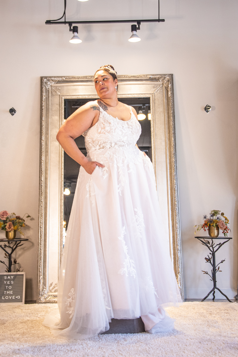 woman posing in white bridal gown with pockets