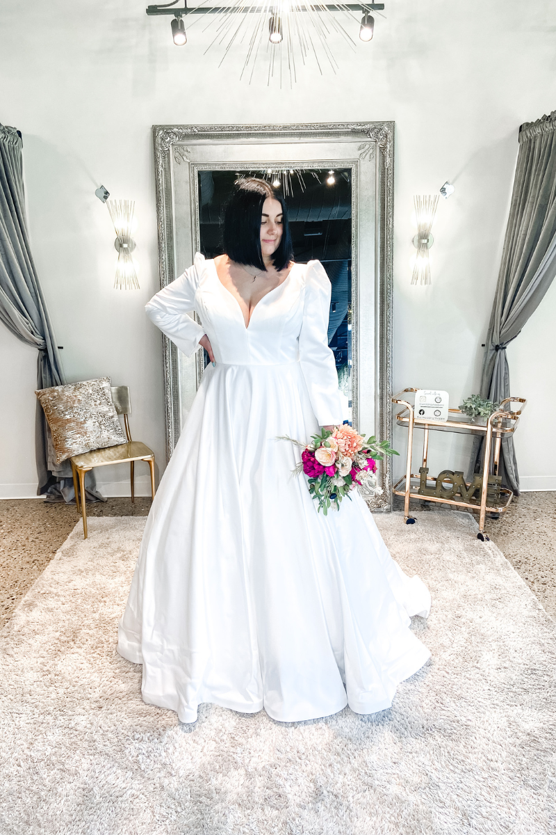 woman in sleeved white wedding gown made for cold weather
