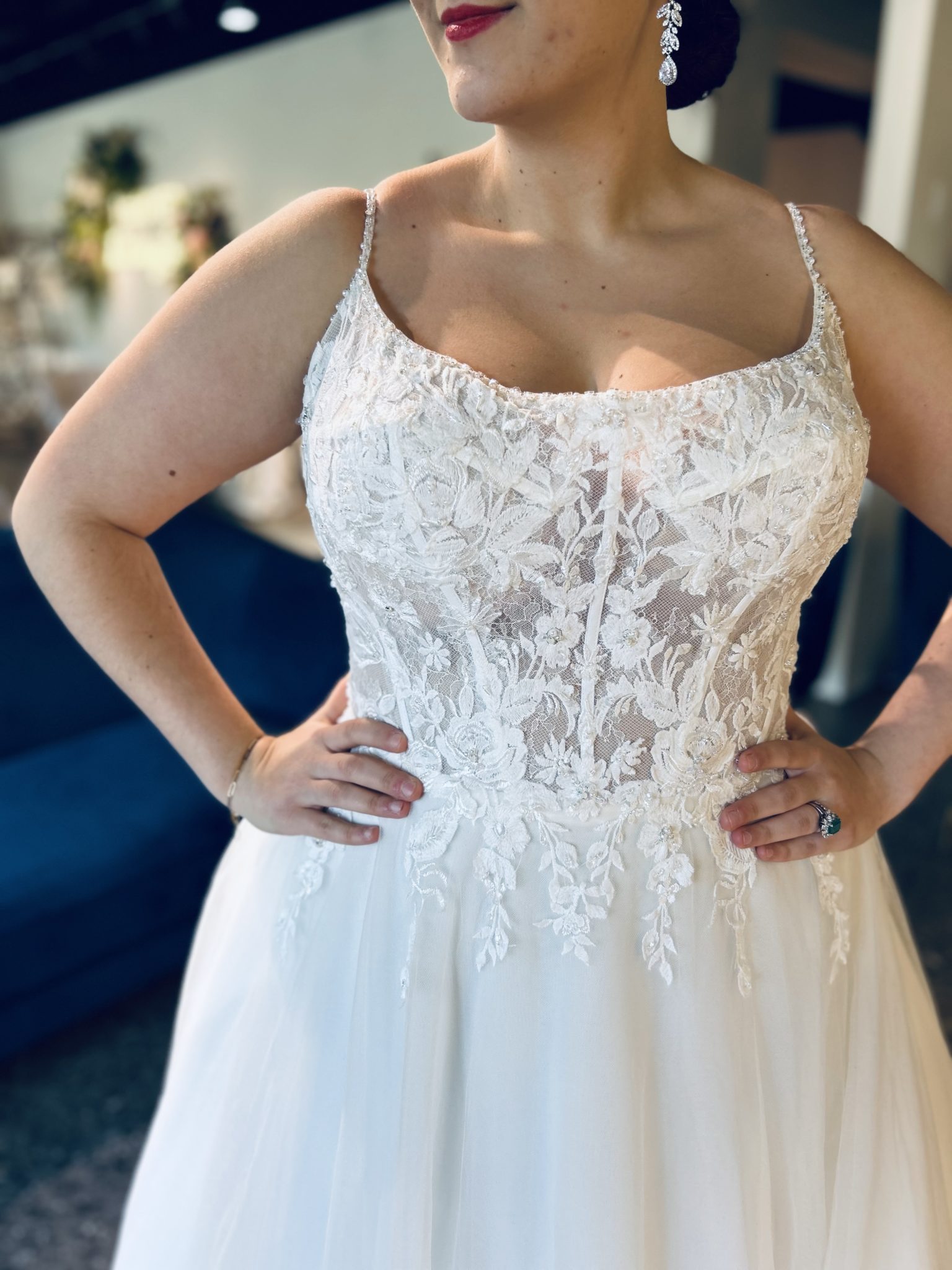 woman in laced wedding dress with a scoop neckline