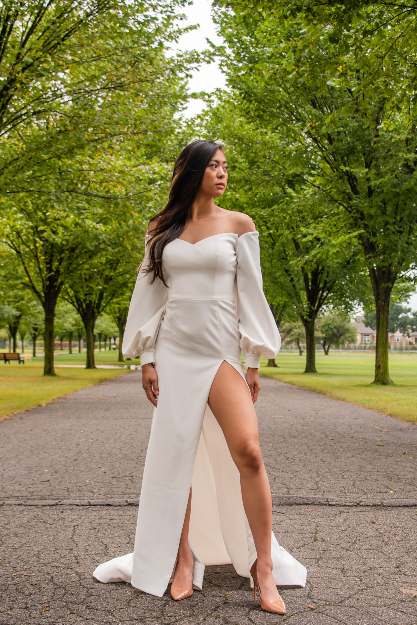 woman in 80s style puffy wedding dress with leg slit