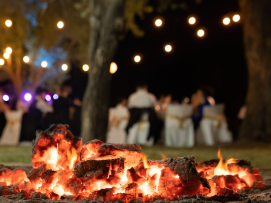 bonfire at outdoor wedding in a sparkling forest