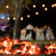 bonfire at outdoor wedding in a sparkling forest