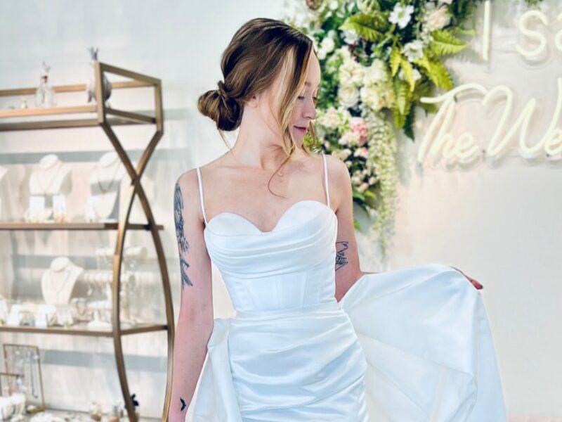 Kirsten is a fitted gown with a sweetheart neckline and high slit