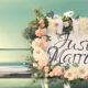 Floral "Just Married" sign on back of car