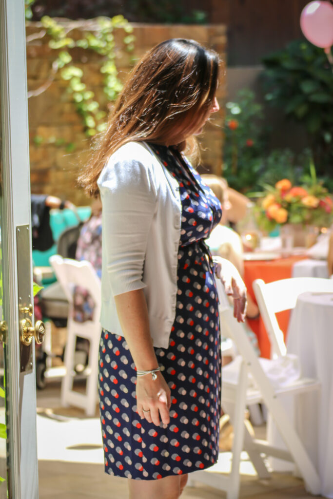 woman in a polka dot dress looking at a bridal shower venue