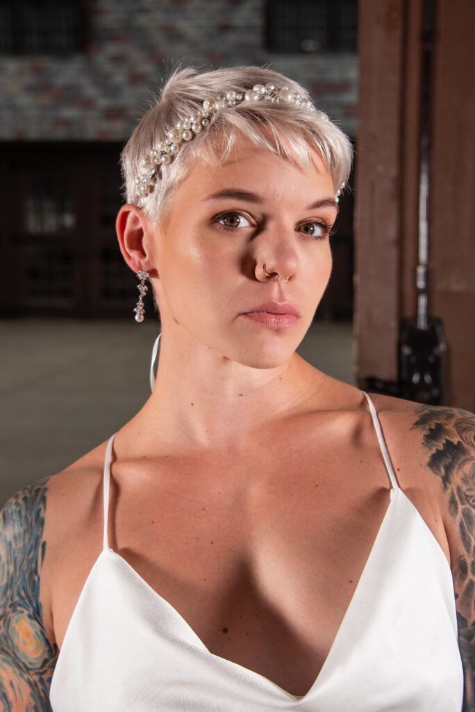 tattooed bride with a pixie haircut and a pearl tiara accessory