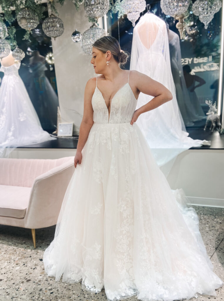 Rae is an a-line wedding gown with a deep plunge and stunning lace