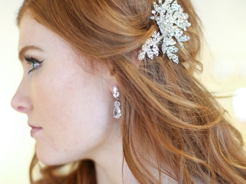 bride with red hair and a crystal floral accessory