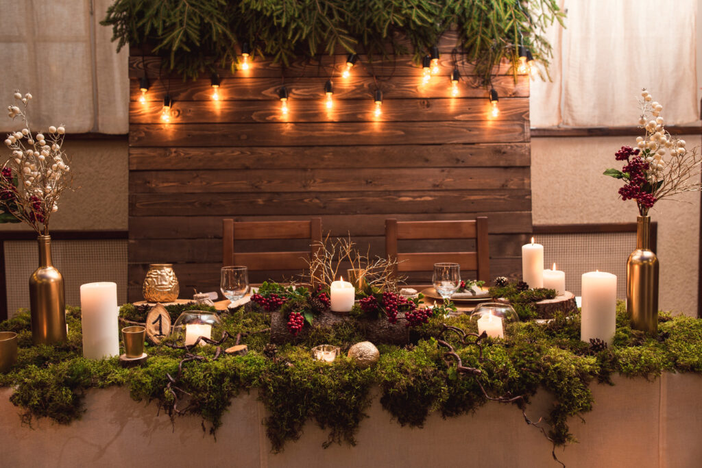 gorgeous table set up with moss, candles, and natural elements for a fairytale wedding