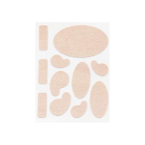 A small sheet of skin toned blister patches in varying shapes and sizes.