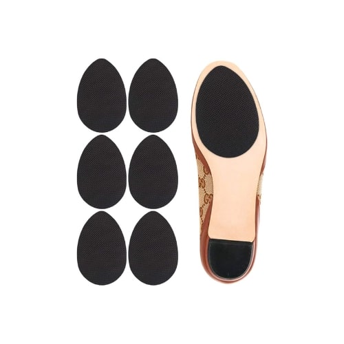 On the left are three sets of black, non slip pads for the bottom of your shoes. On the right is an image of the bottom of a ballet flat with the non-slip pad attached to the ball of the shoe.