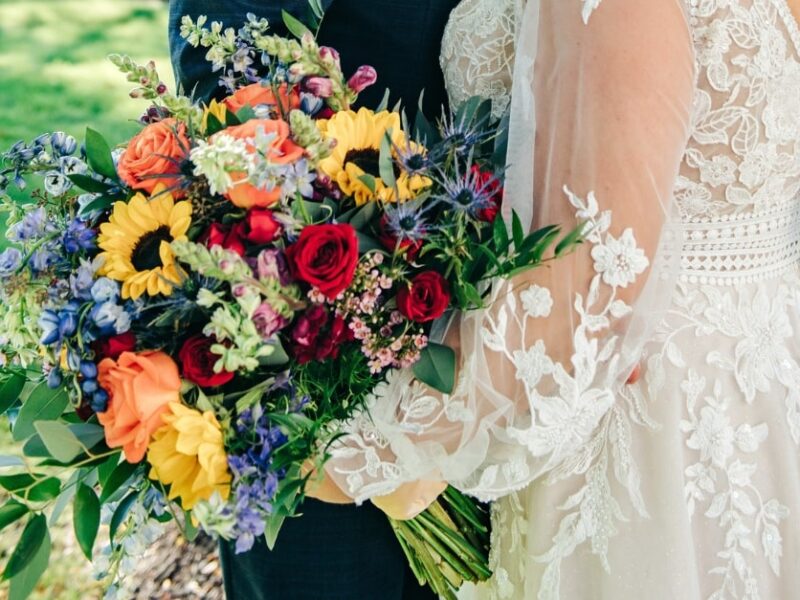 beautiful bouquet of flowers, including red, orange, yellow, and blue flowers
