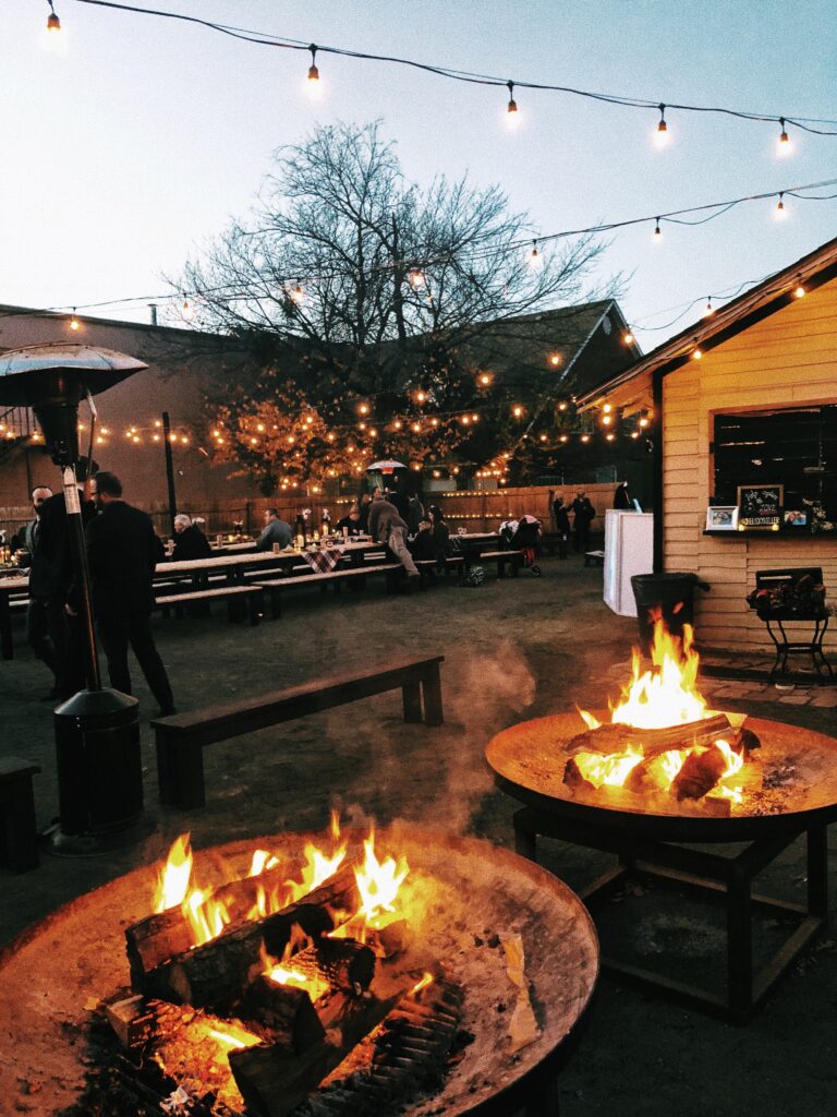 two fire pits with outdoor seating for a fall wedding