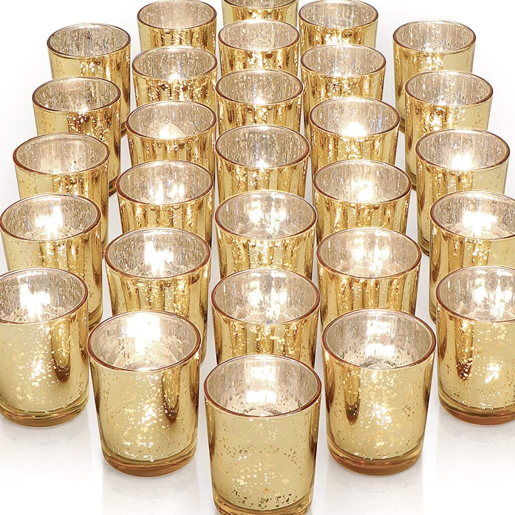 Group of small gold leaf votive candle holders.