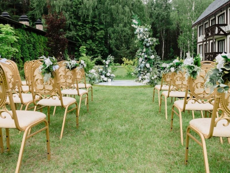 wedding seating for a Victorian wedding with gold chairs and floral detailing
