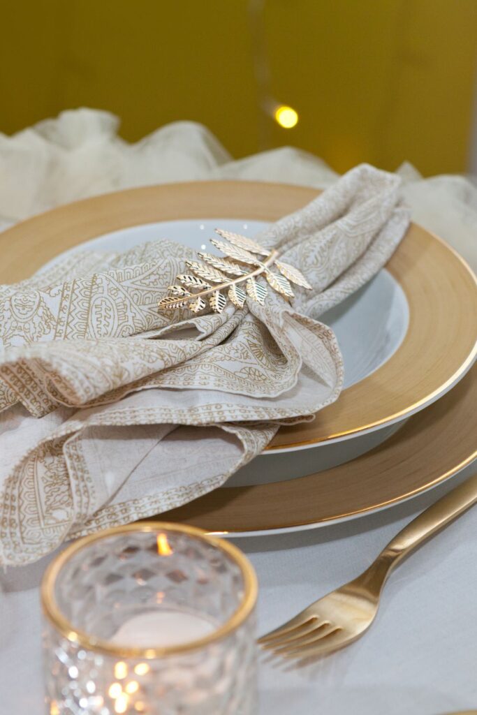 lavish gold tableware with gold leaf and gold silverware for a Victorian wedding