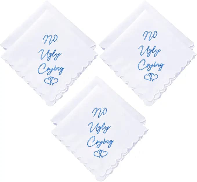Three white handkerchiefs folded with blue embroidery saying "No Ugly Crying"