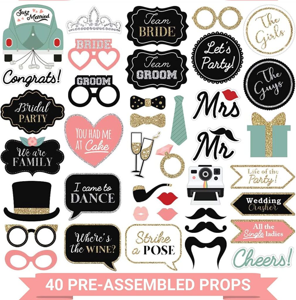 Layout of photo props in black, white and pink. There are pops of gold and sage green.