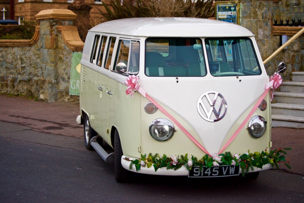 old-school VW bus adorned with wedding decor for a retro wedding