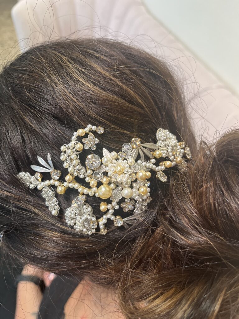 Bride wearing the Forgiveness hair comb, encrusted with crystal and pearls—handmade.
