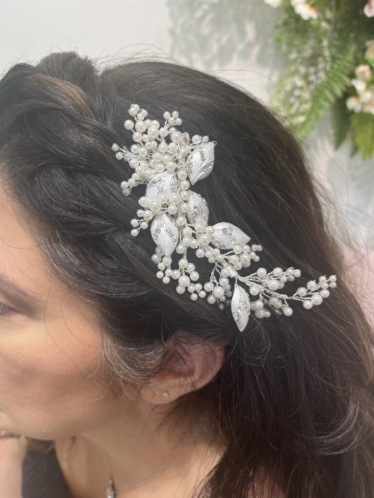 Bride wearing the Wonder hair clip with pearl and crystal details.