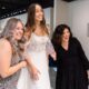 three women excited about the bride's new wedding dress