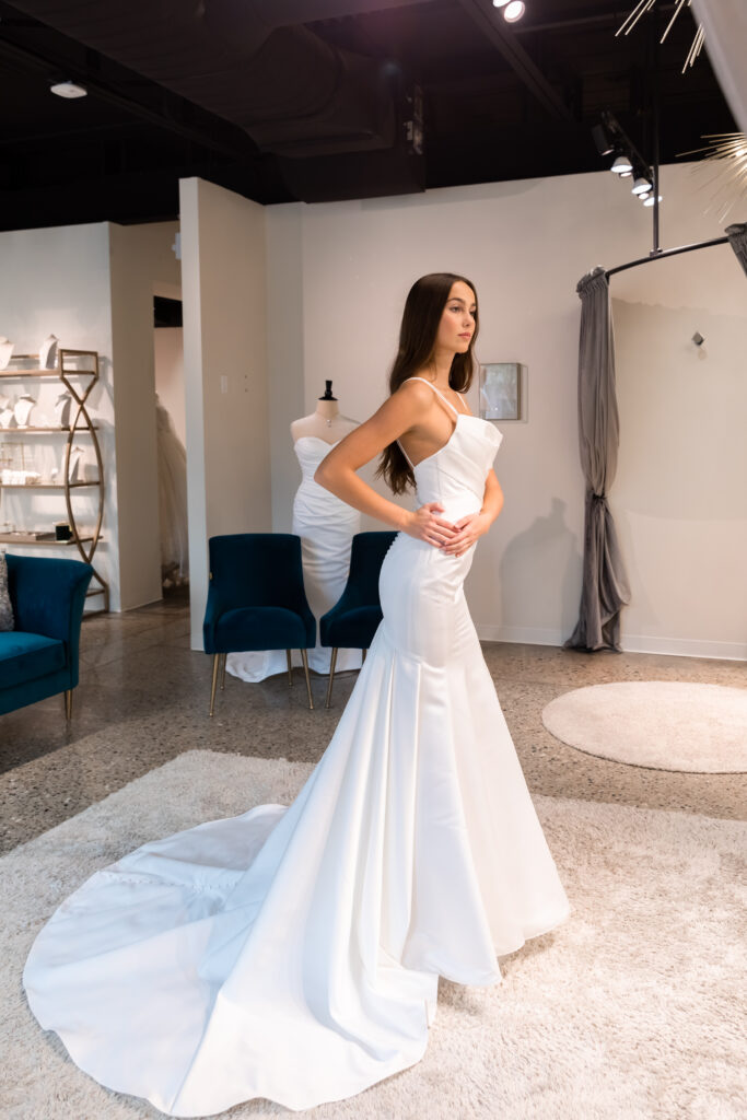 a woman in her dream wedding dress at the Wedding Shoppe