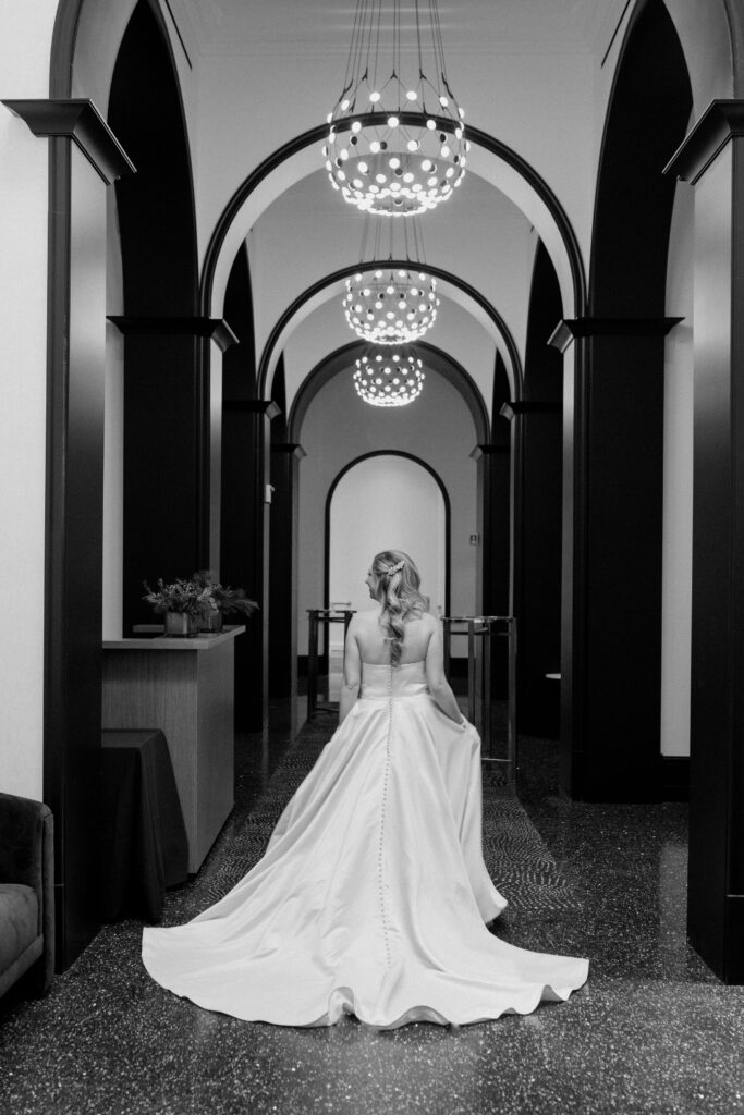 bride walking down hallway in the Daxton Hotel in Birmingham, Michigan