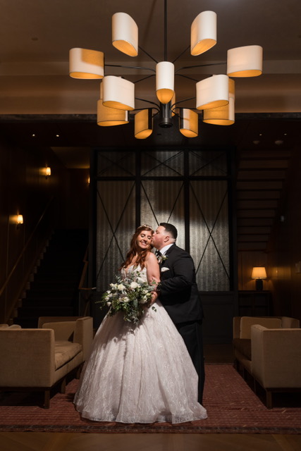 newly married couple kissing at the Shinola Hotel in Michigan