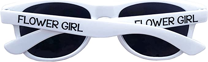 A pair of white sunglasses with the words "Flower Girl" printed on them.