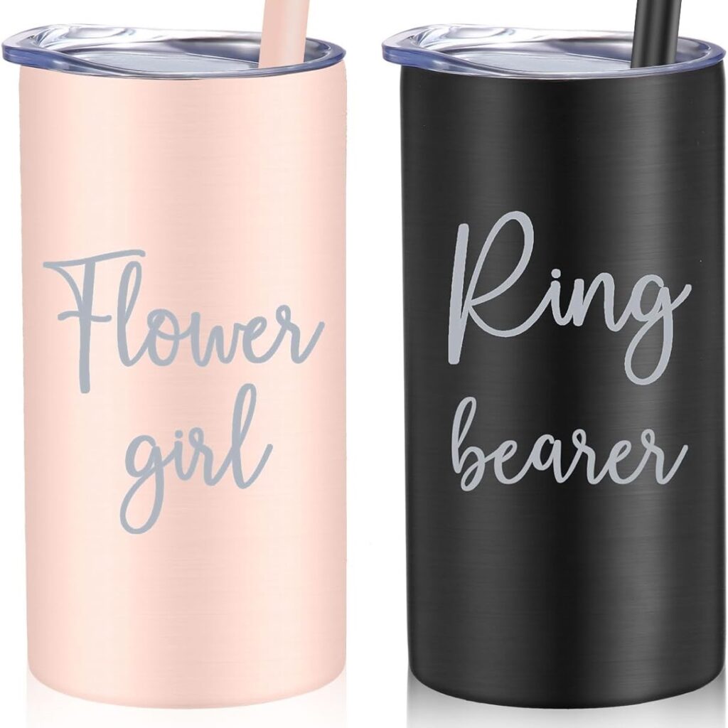 Pink stainless steal tumbler that says "Flower Girl" sitting next to a black stainless steal tumbler that says "ring bearer"