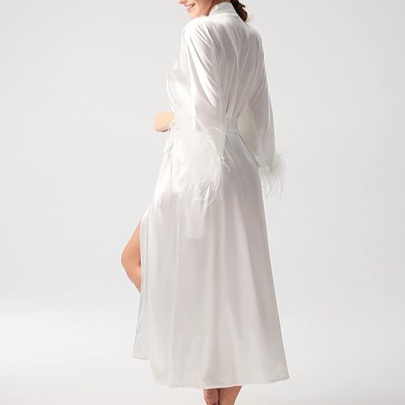 Long, white kimono with ostrich feathers lining the sleeves.