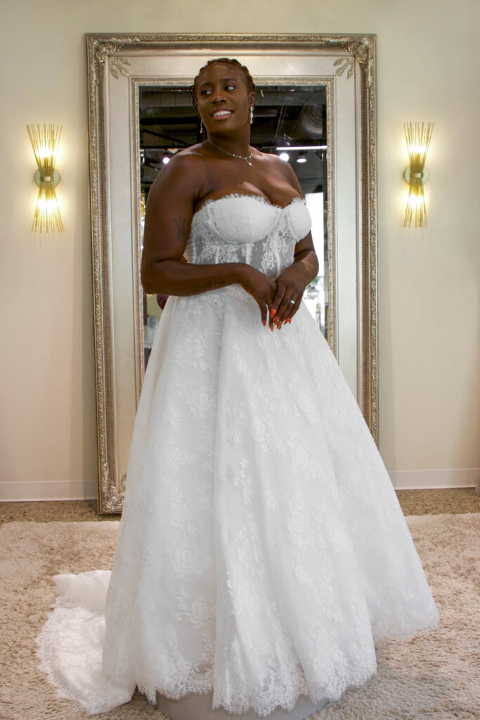 Alyssa reminds me of the song “Paris” beautiful delicate lace gown with a sheer corset bodice and traditional hem lace.