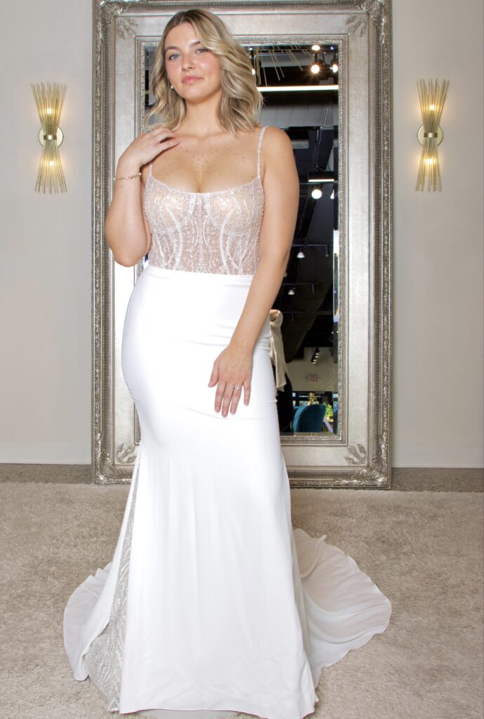 Twyla is a beaded scoop neckline with thin beaded straps and a crepe bottom