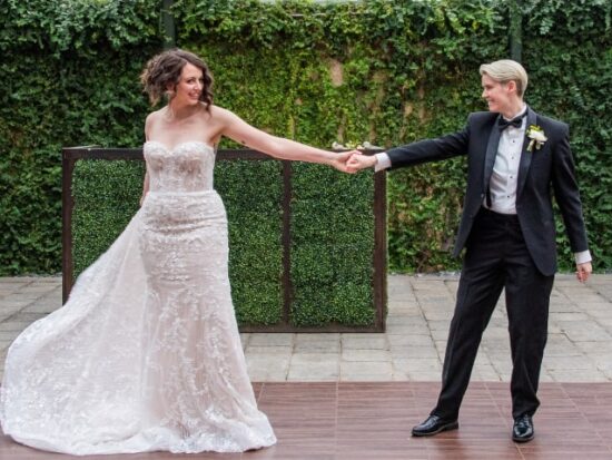 Corinne and Alicia at the Planterra Conservatory, wearing the Allure dress and the Randazzo Formalwear suit.