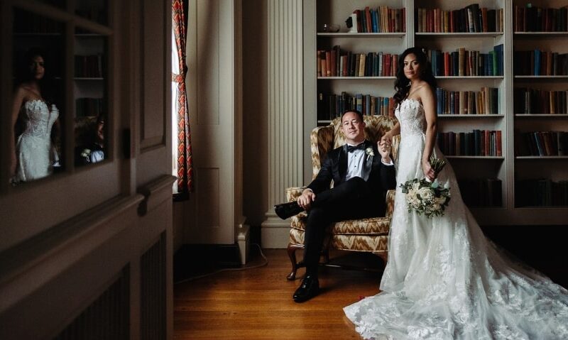 new husband and wife in a breathtaking library venue for their wedding
