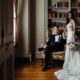 new husband and wife in a breathtaking library venue for their wedding