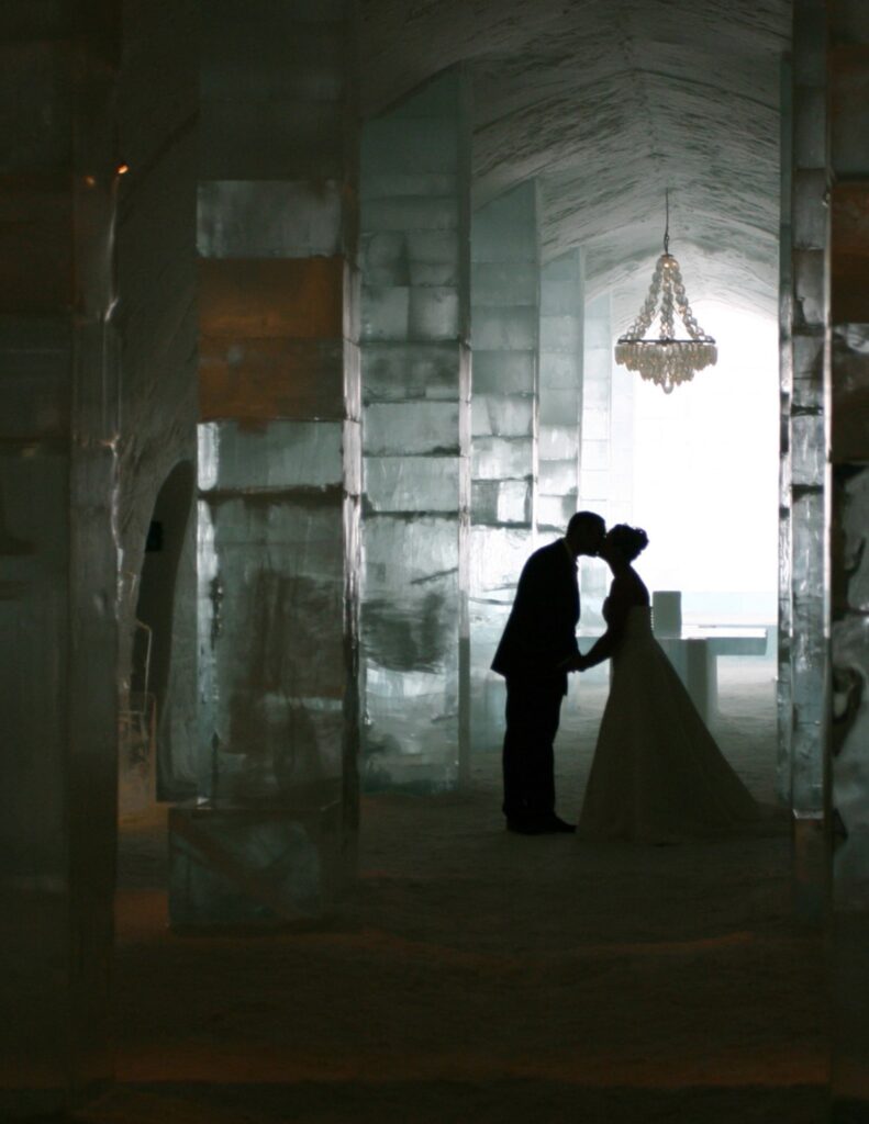 couple sharing a kiss in the sweden ice hotel
