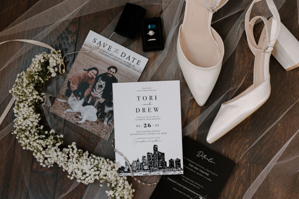 save the date invitations and floral elements, jewelry, and shoes
